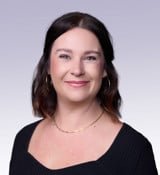 A woman wearing a black dress.