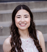 A person smiling for the camera.