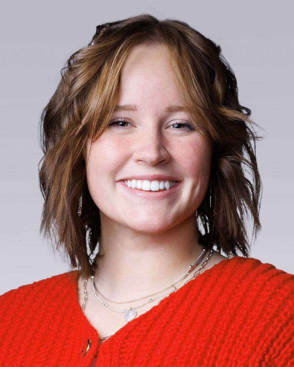 A woman smiling for the camera.