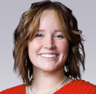 A woman smiling for the camera.