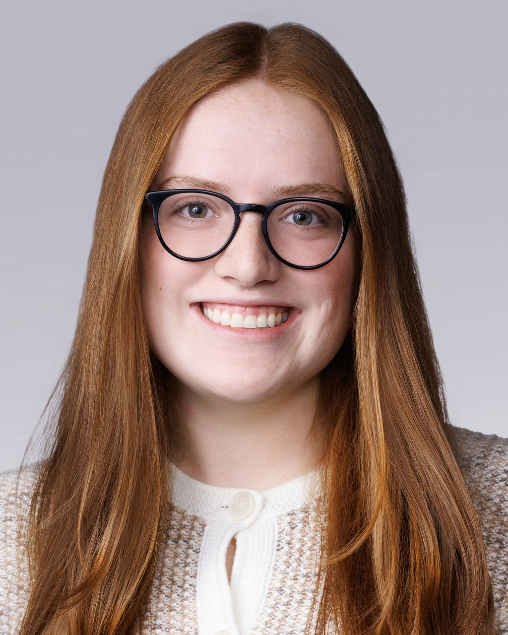 A person with long hair and glasses.