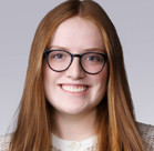 A person with long hair and glasses.