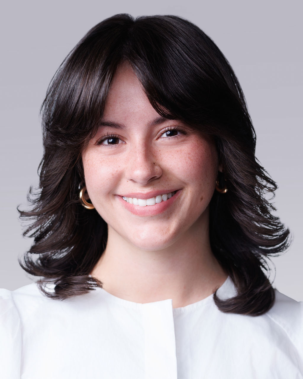 A close-up of a woman smiling.