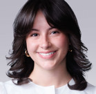 A close-up of a woman smiling.