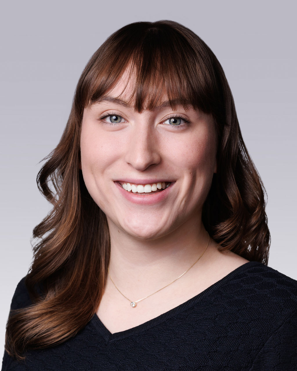 A close-up of a woman smiling.