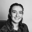 A woman smiling for the camera.