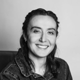 A woman smiling for the camera.