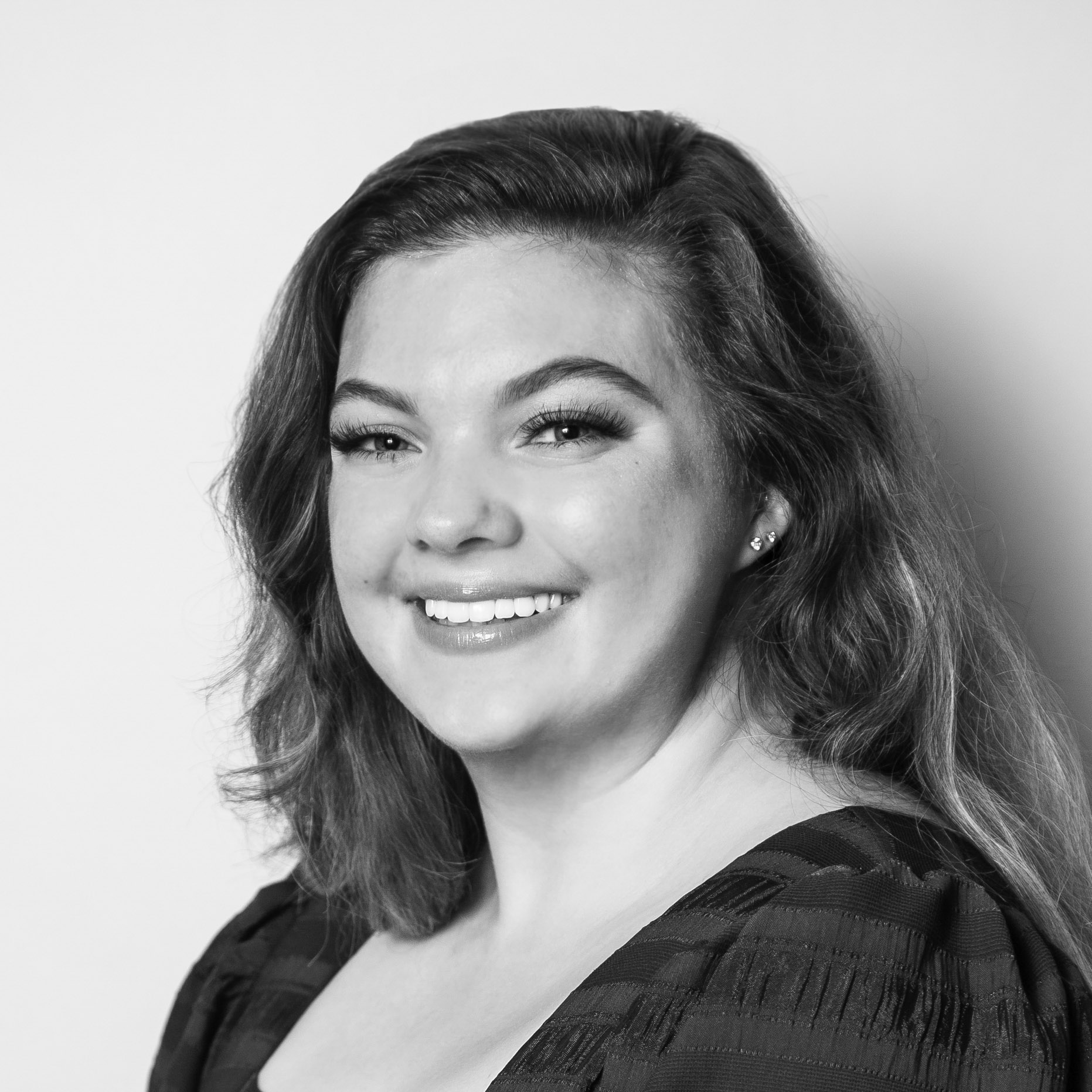 A woman smiling for the camera.