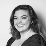 A woman smiling for the camera.