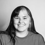 A woman smiling for the camera.