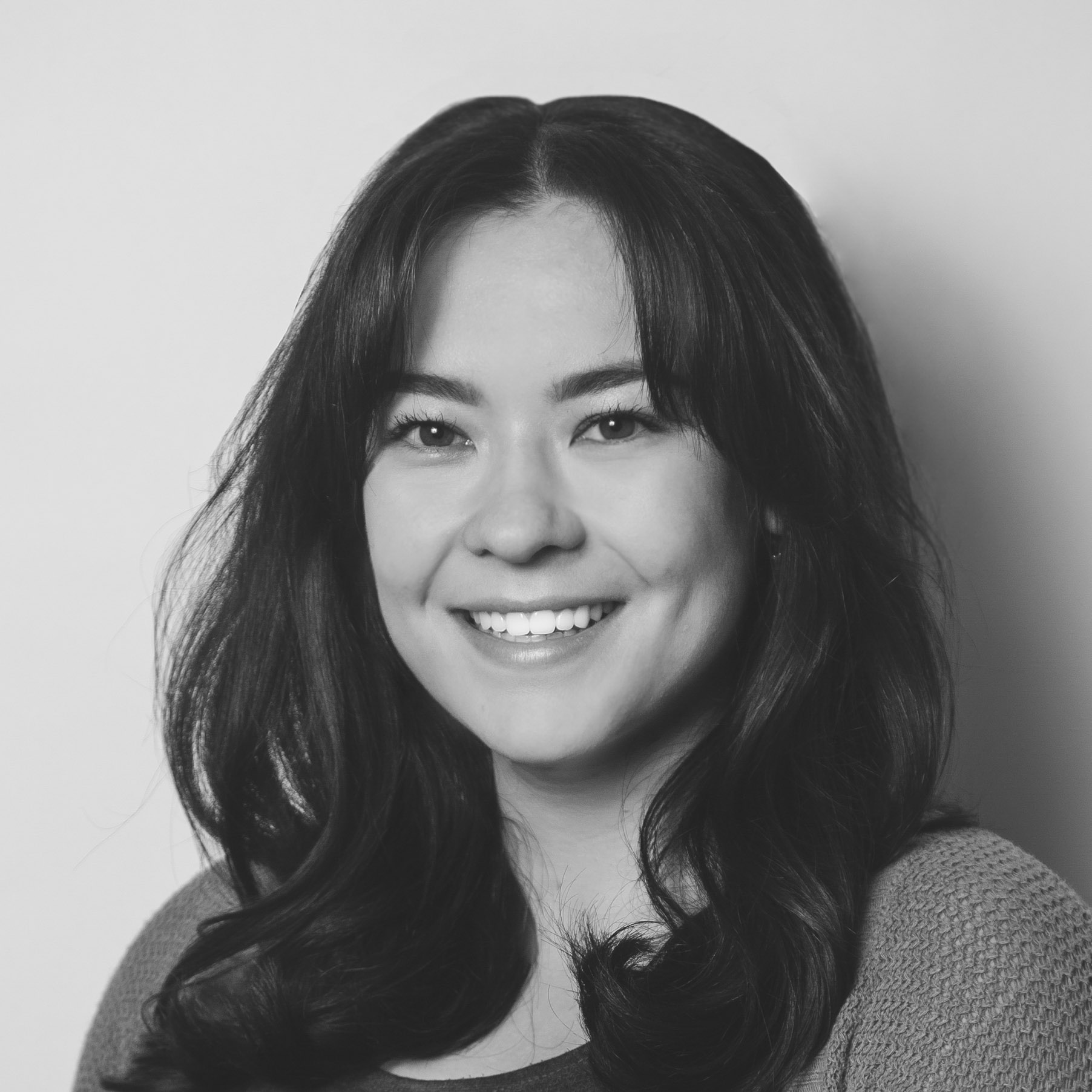 A woman smiling for the camera.