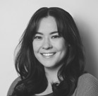 A woman smiling for the camera.