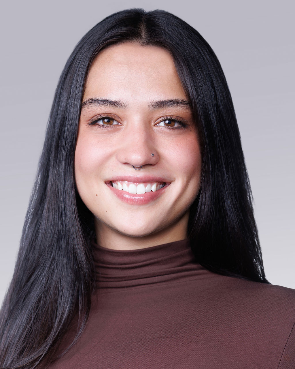 A woman with dark hair.