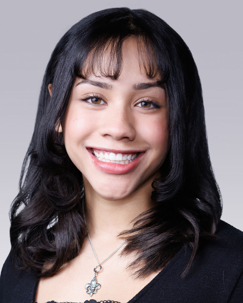 A woman smiling for the camera.