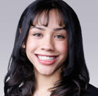 A woman smiling for the camera.