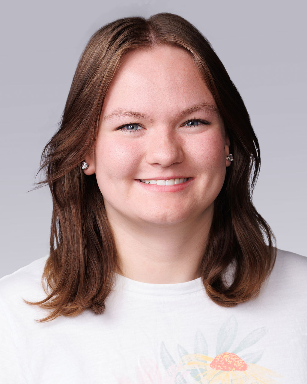 A close-up of a woman smiling.