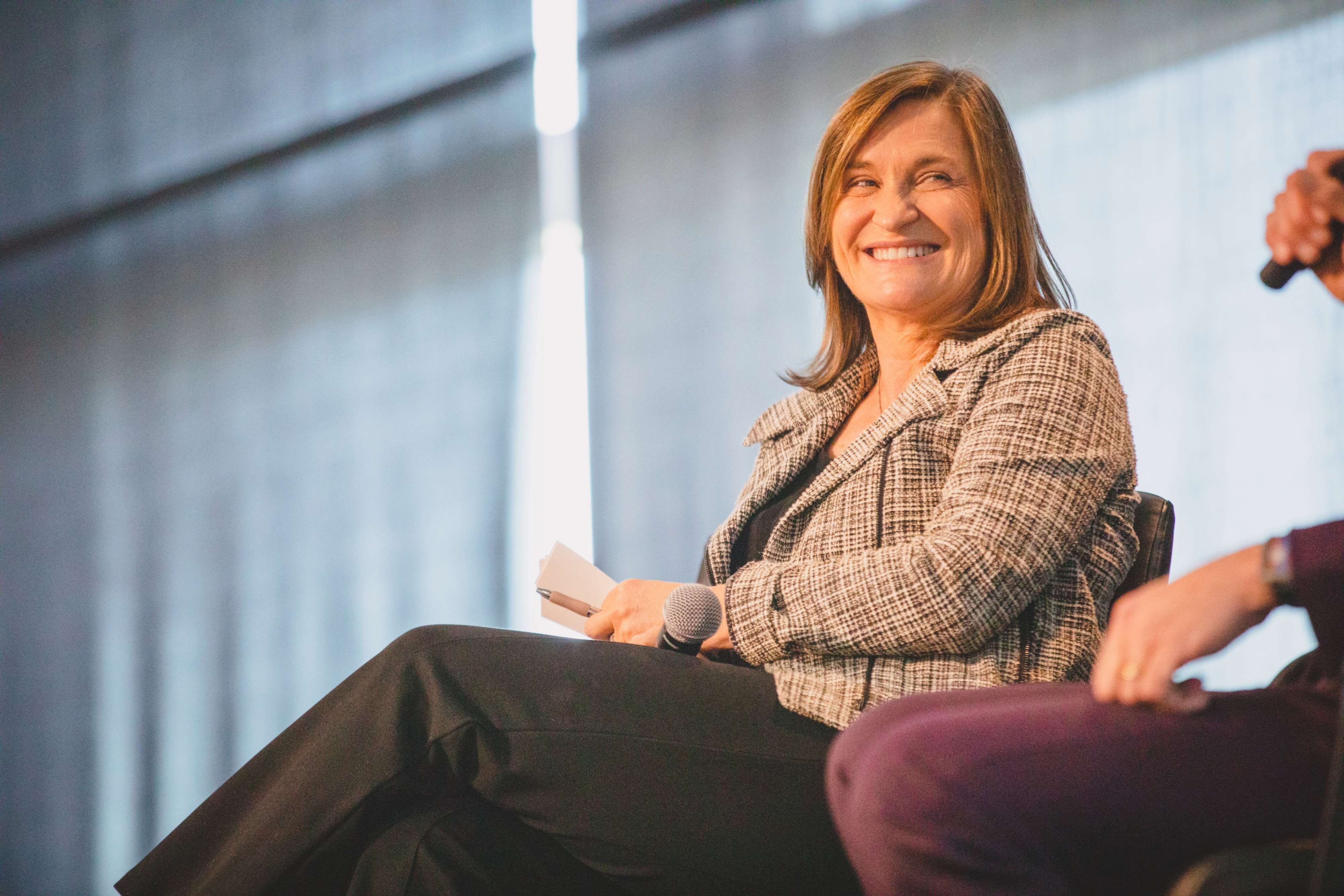 Jenny Wilson sitting on a couch.