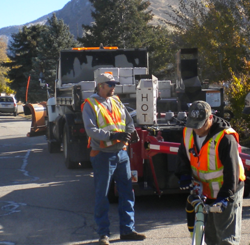 A group of men working on a road.