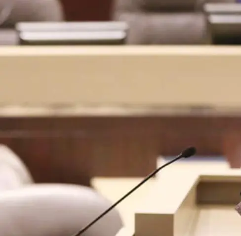 A woman talking to another woman.