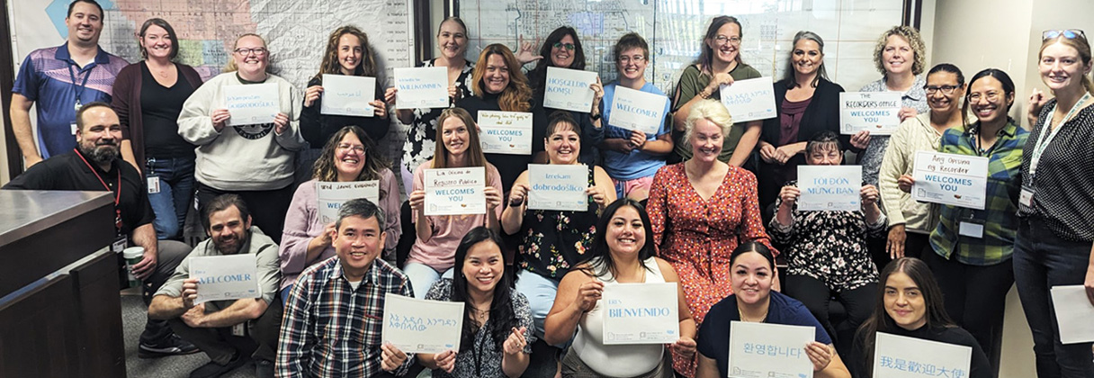 Leila Barros et al. holding signs.