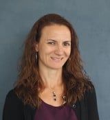 A person smiling for the camera.