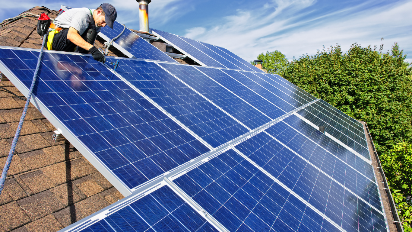A person working on a solar panel.