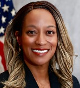 A woman smiling for the camera.