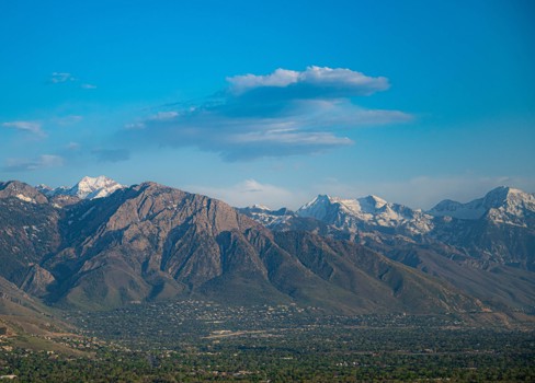 A landscape with mountains in the back.