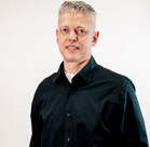 A man wearing a black jacket.