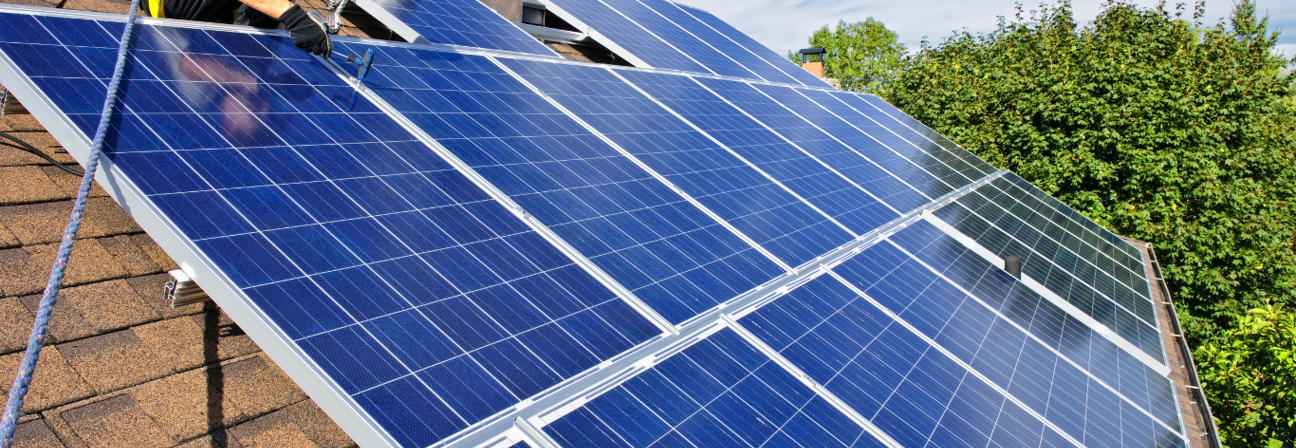 A person working on a solar panel.
