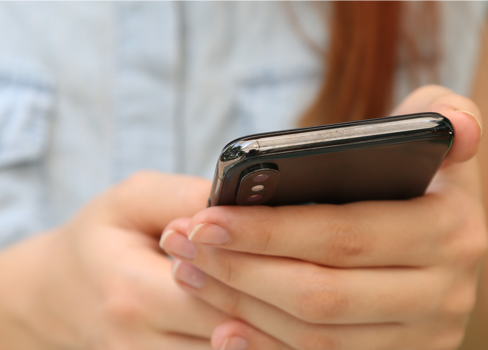 A person holding a cell phone.
