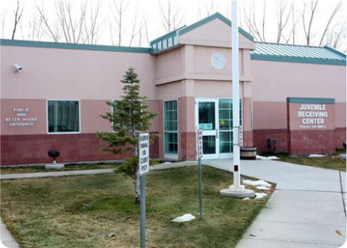 A building with a sign in front.