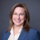 A woman wearing glasses.