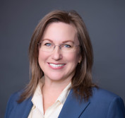 A woman wearing glasses.