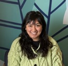 A woman smiling for the camera.