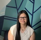 A woman wearing glasses.