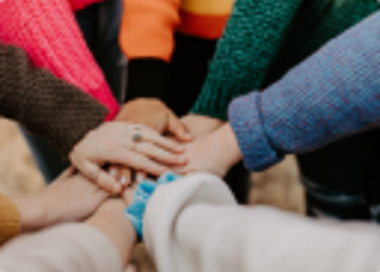 Close-up of people clapping.