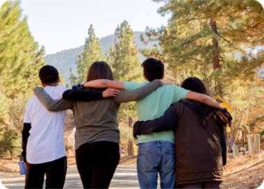 A group of people embracing.