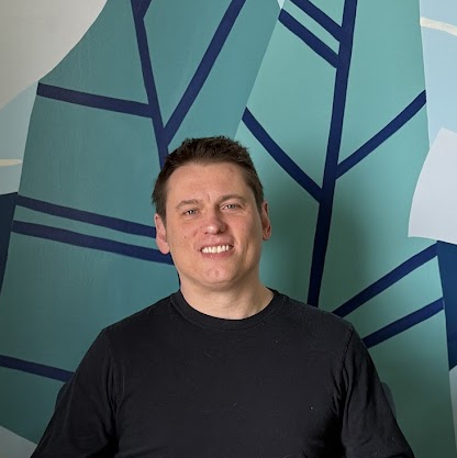 A man smiling for the camera.