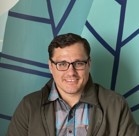 A man wearing glasses.