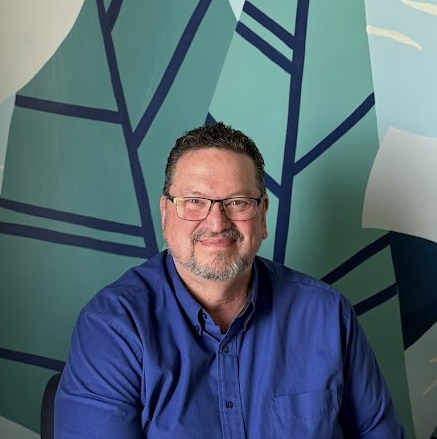 A man wearing glasses.