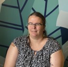 A woman wearing glasses.