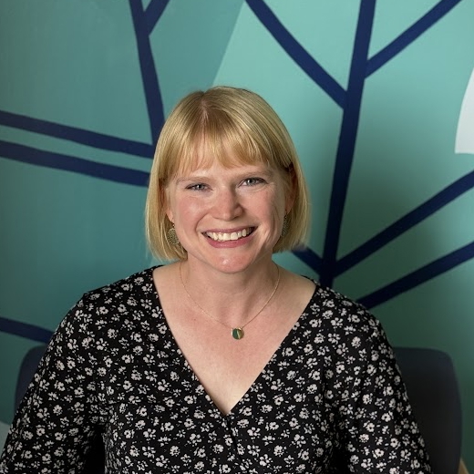 A woman smiling for the camera.