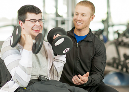 A man sitting next to another man.