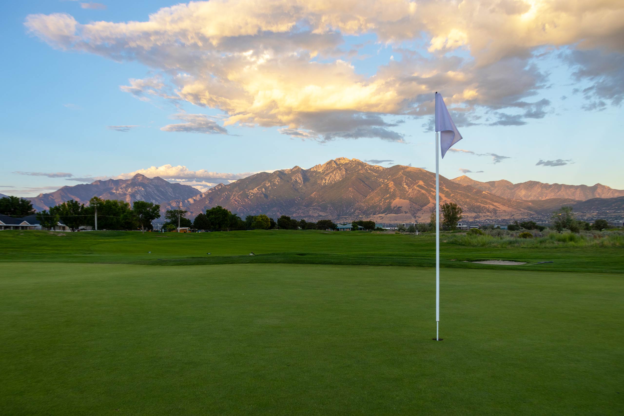 A golf course flag on the green of a hole at Riverbend Golf Course in Salt Lake City.
