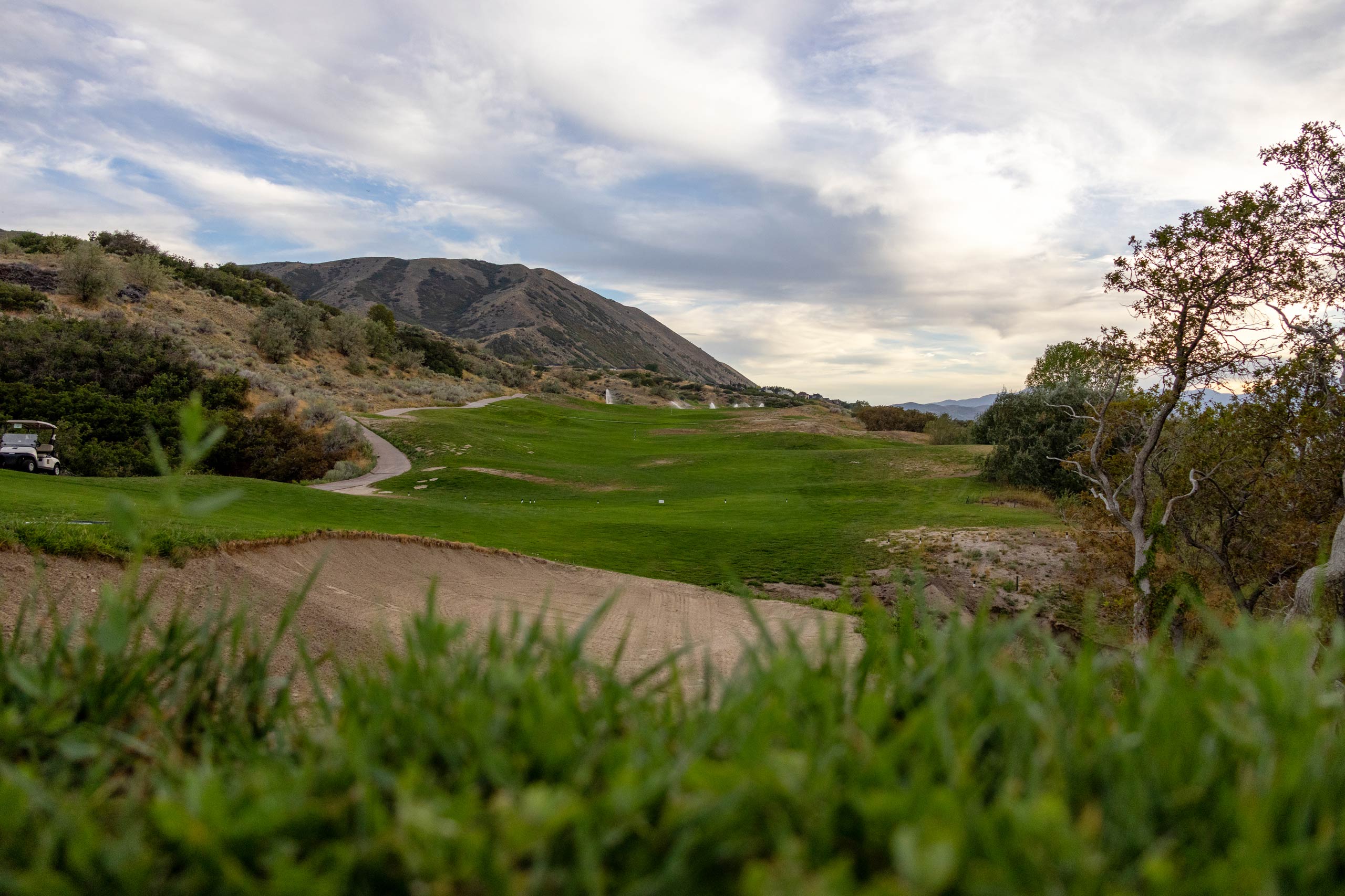 A view of a sand trap and fairway of a golf course hole at South Mountain golf course in Salt Lake City.