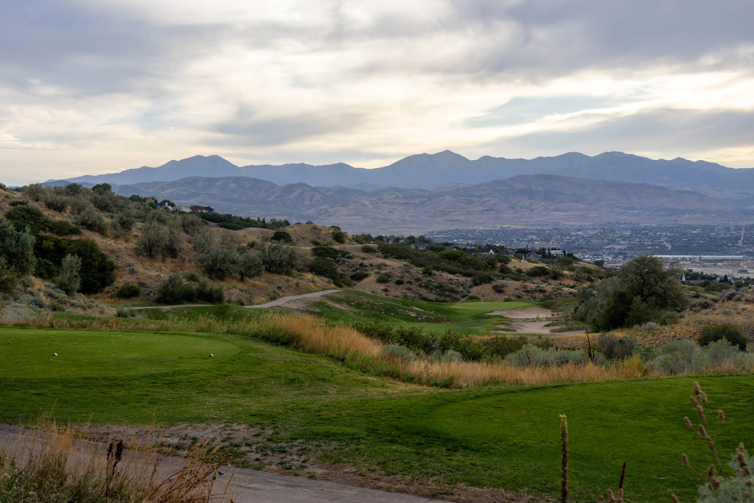 A golf course landscape with hills and trees at South Mountain golf course in Salt Lake City.