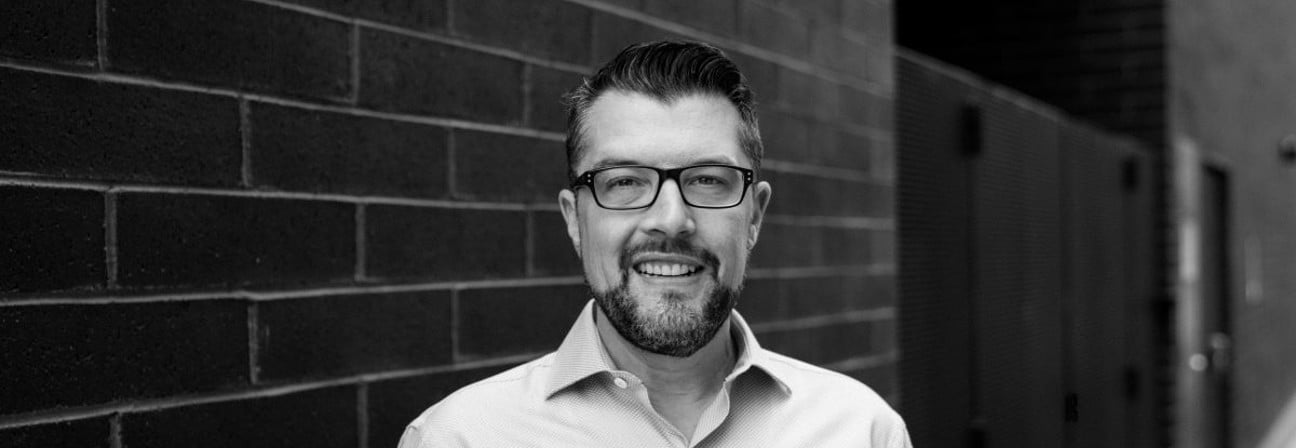 A man wearing glasses.