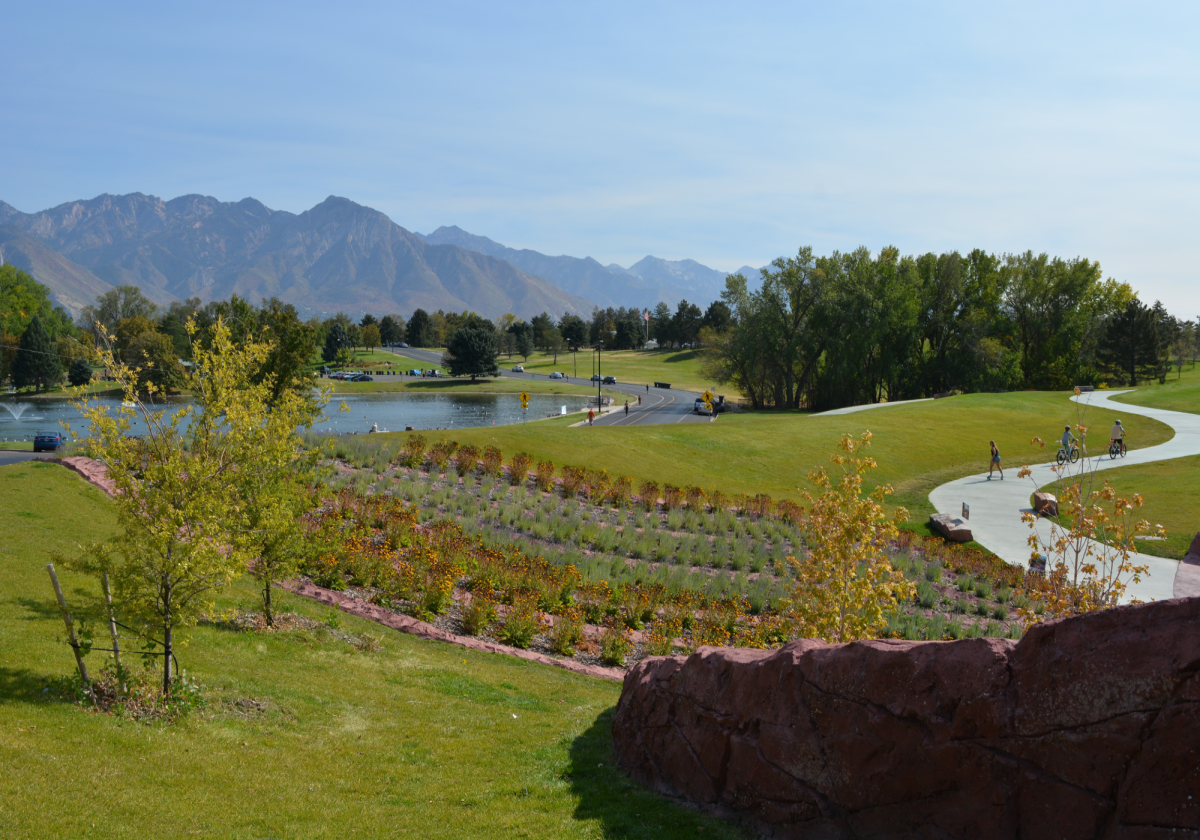 A golf course with a pond.