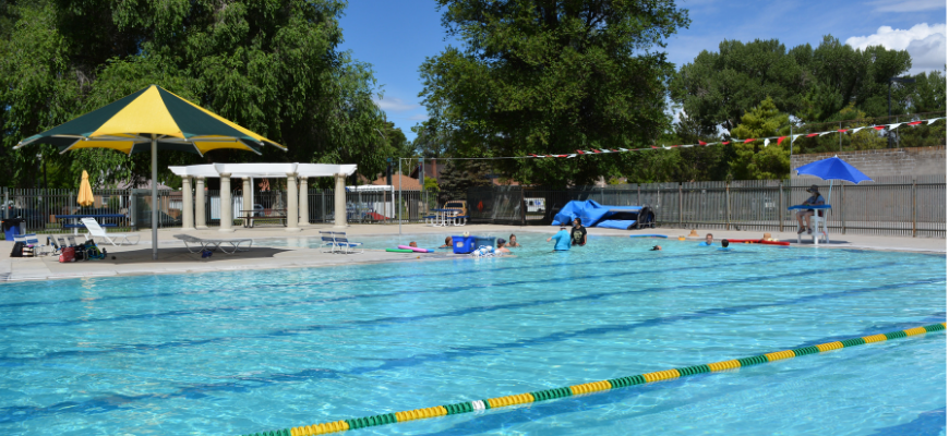 A pool with people in it.